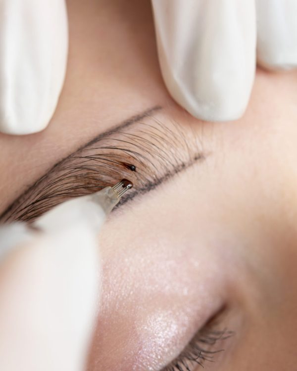 beautician-working-client-s-eyebrows