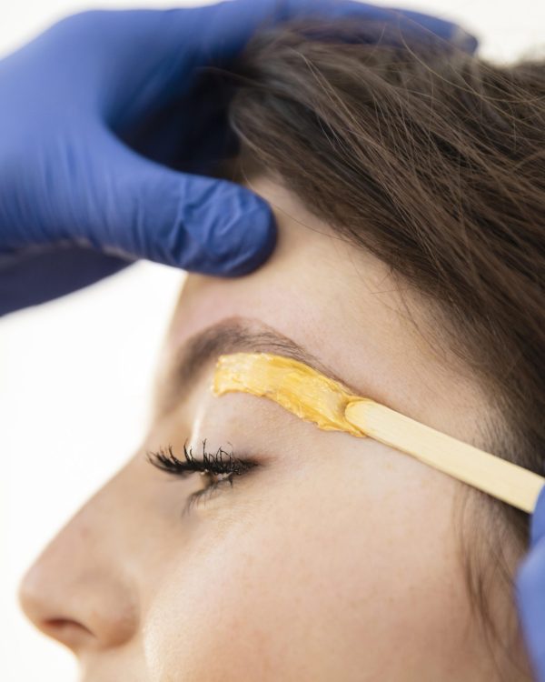 woman-getting-eyebrow-treatment