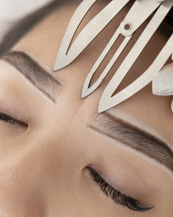 young-female-client-going-through-microblading-procedure